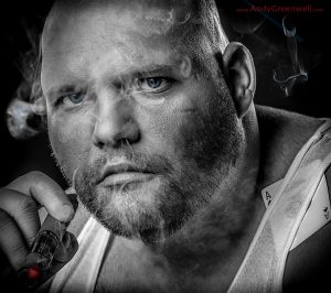 movie actor smoking a cigar in a photo studio